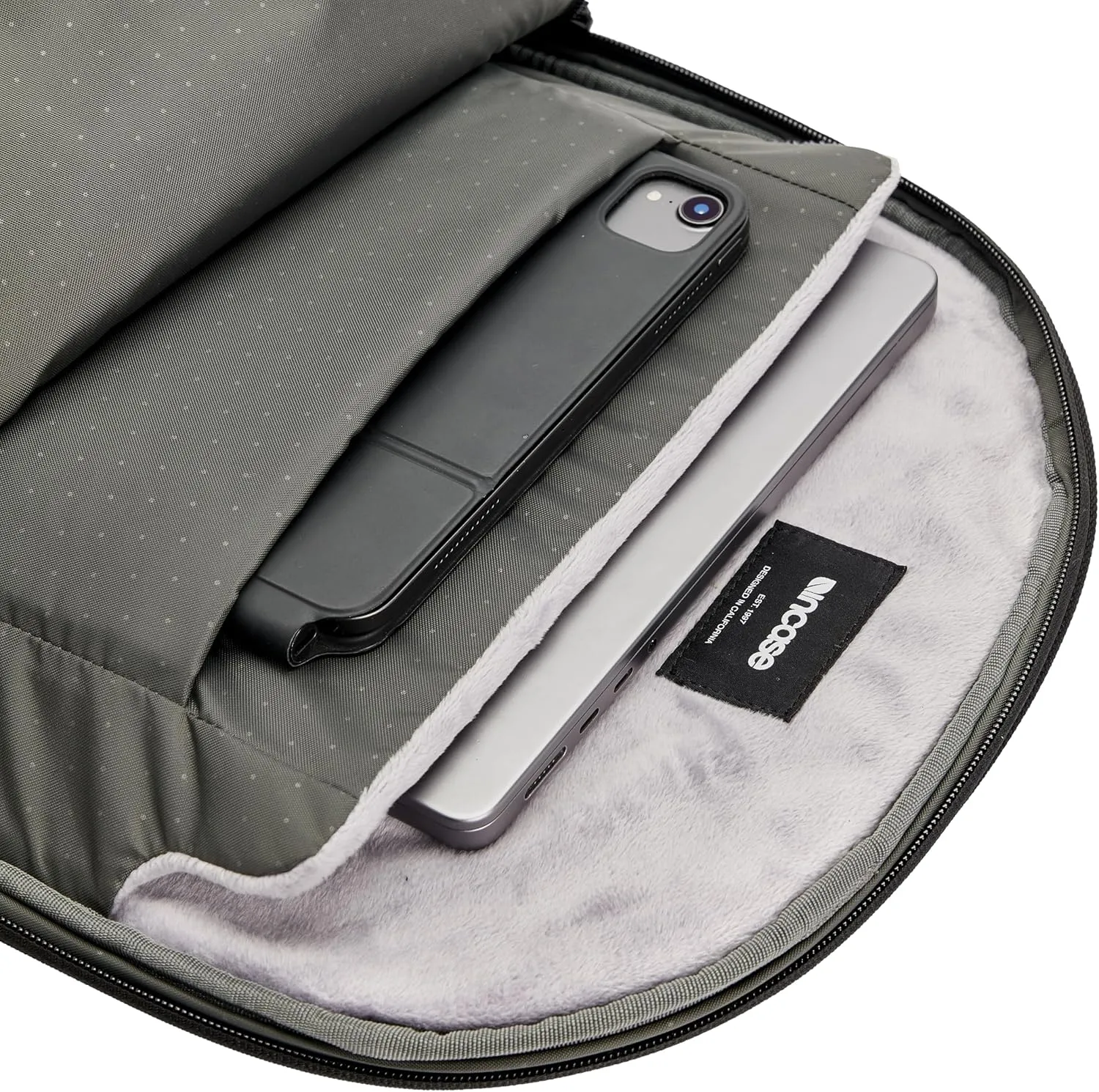 Incase Tracks Backpack - Water Repellent Exterior, Padded Laptop Pocket, Dual Side Pockets, Luggage Pass Through (Black, 18L)